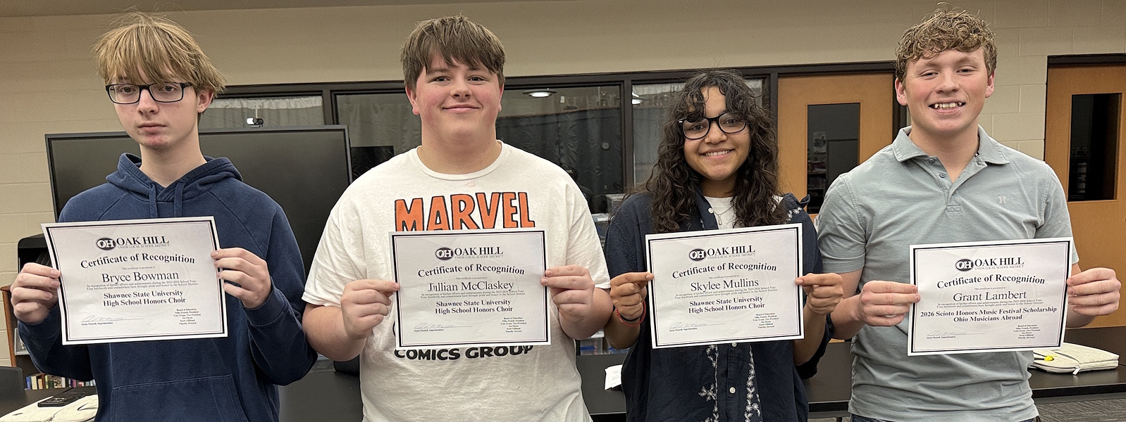 Photo of Bryce Bowman, Jullian McClaskey, Skylee Mullins, and Grant Lambert with their certificates.