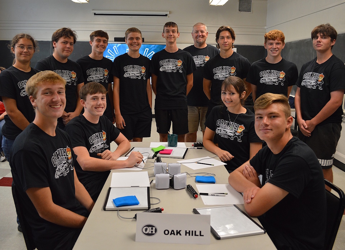 Photo of the 2026 Quiz Bowl Team at the ESC along with coach Bryce Werntz